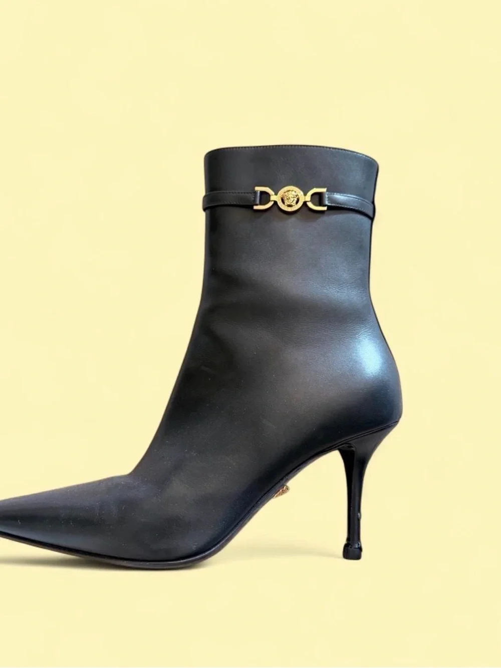 Versace Black Leather Pointed-Toe Stiletto Ankle Boot with Gold Medusa Accent